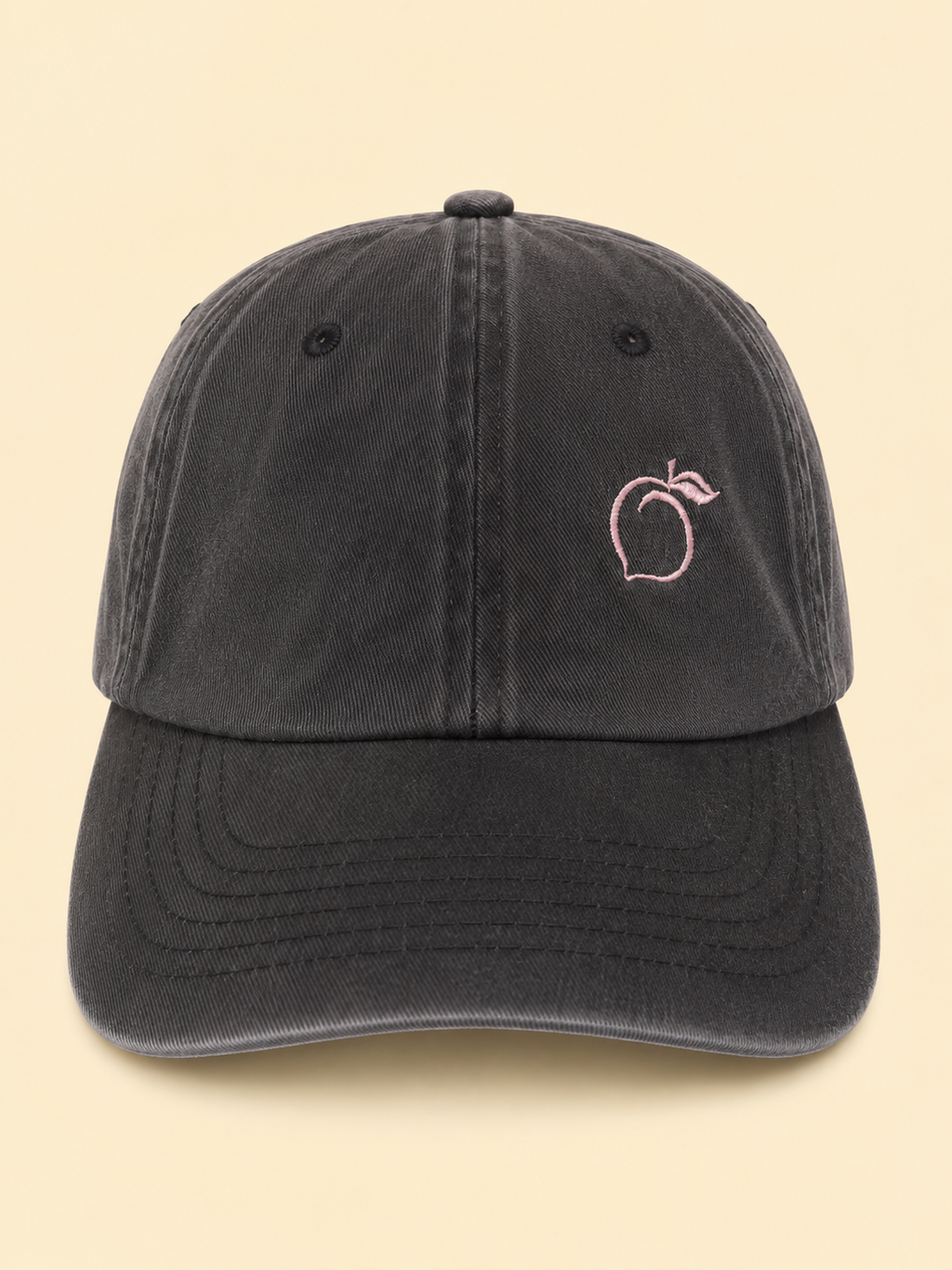 The proud peach relaxed effortlessly cool cap in brushed black SILKY LINED