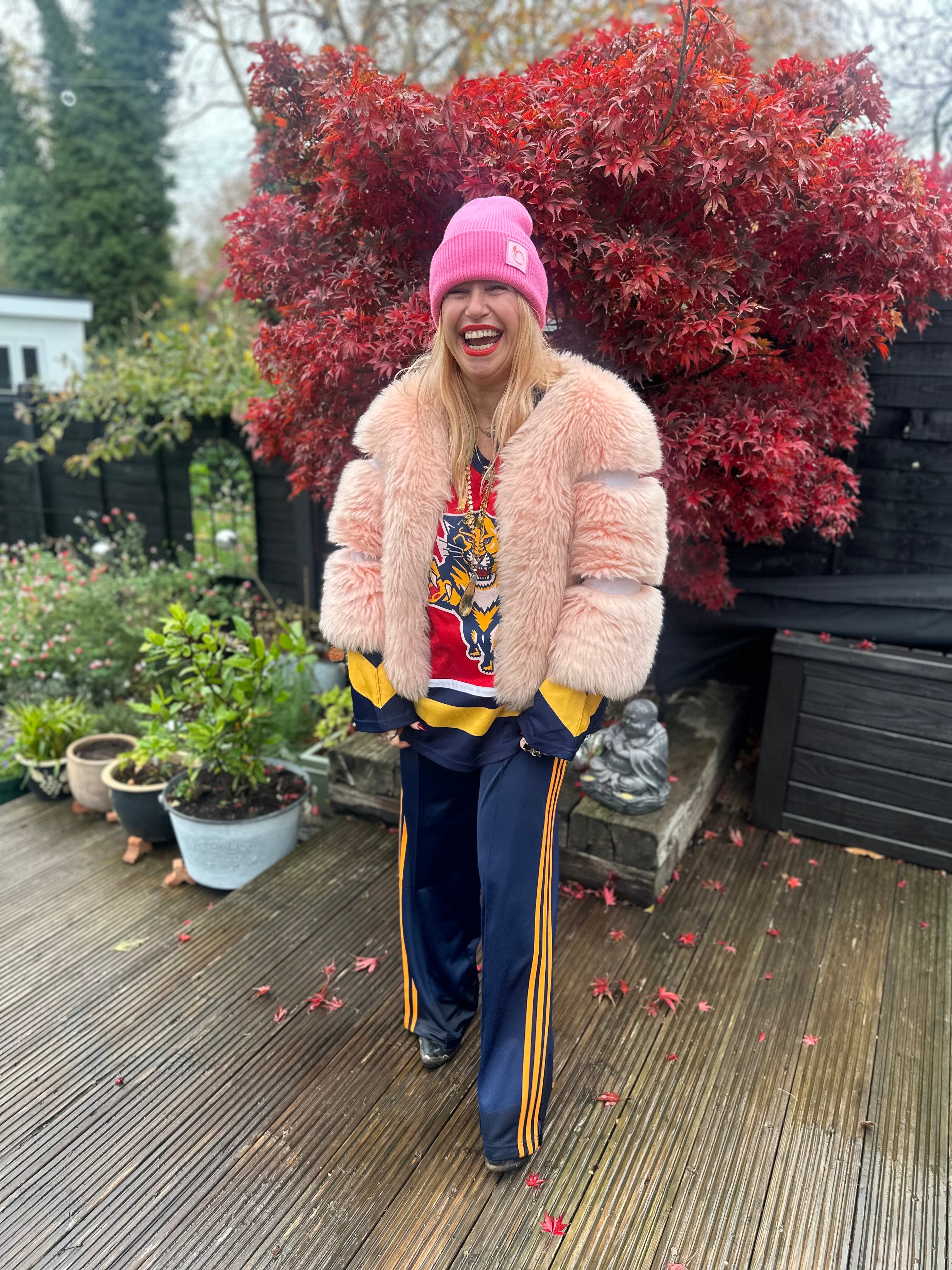 The peachy plush silky lined beanie in flamingo pink