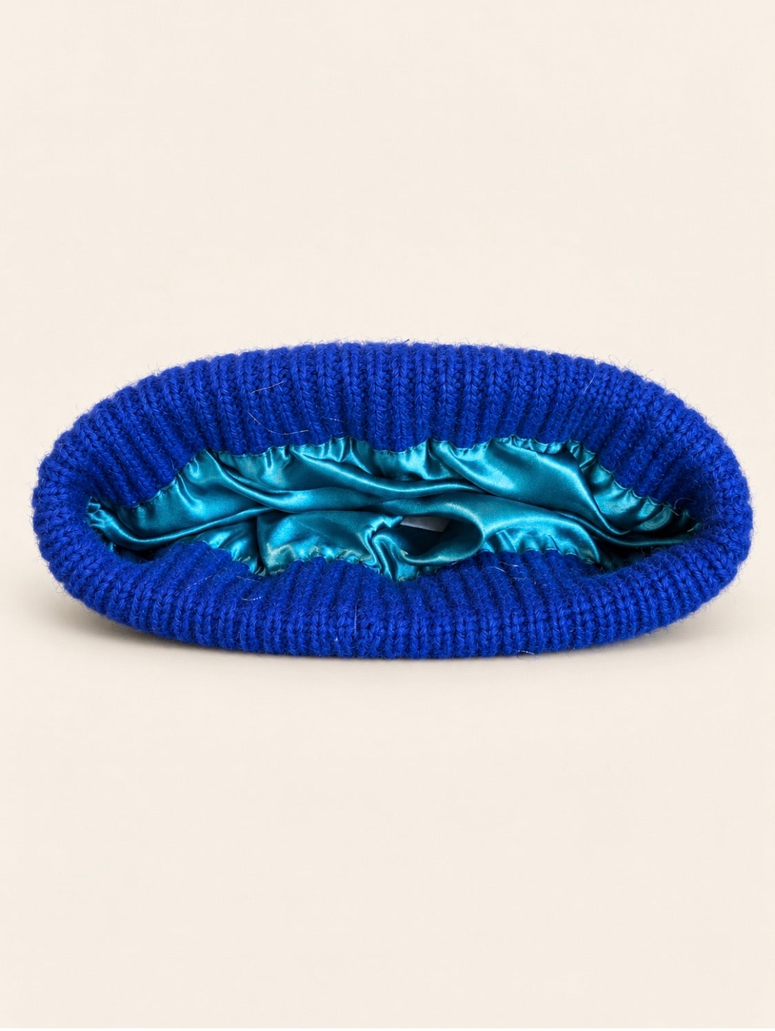 proud peach 100% merino wool silky linede beanie in colbat blue