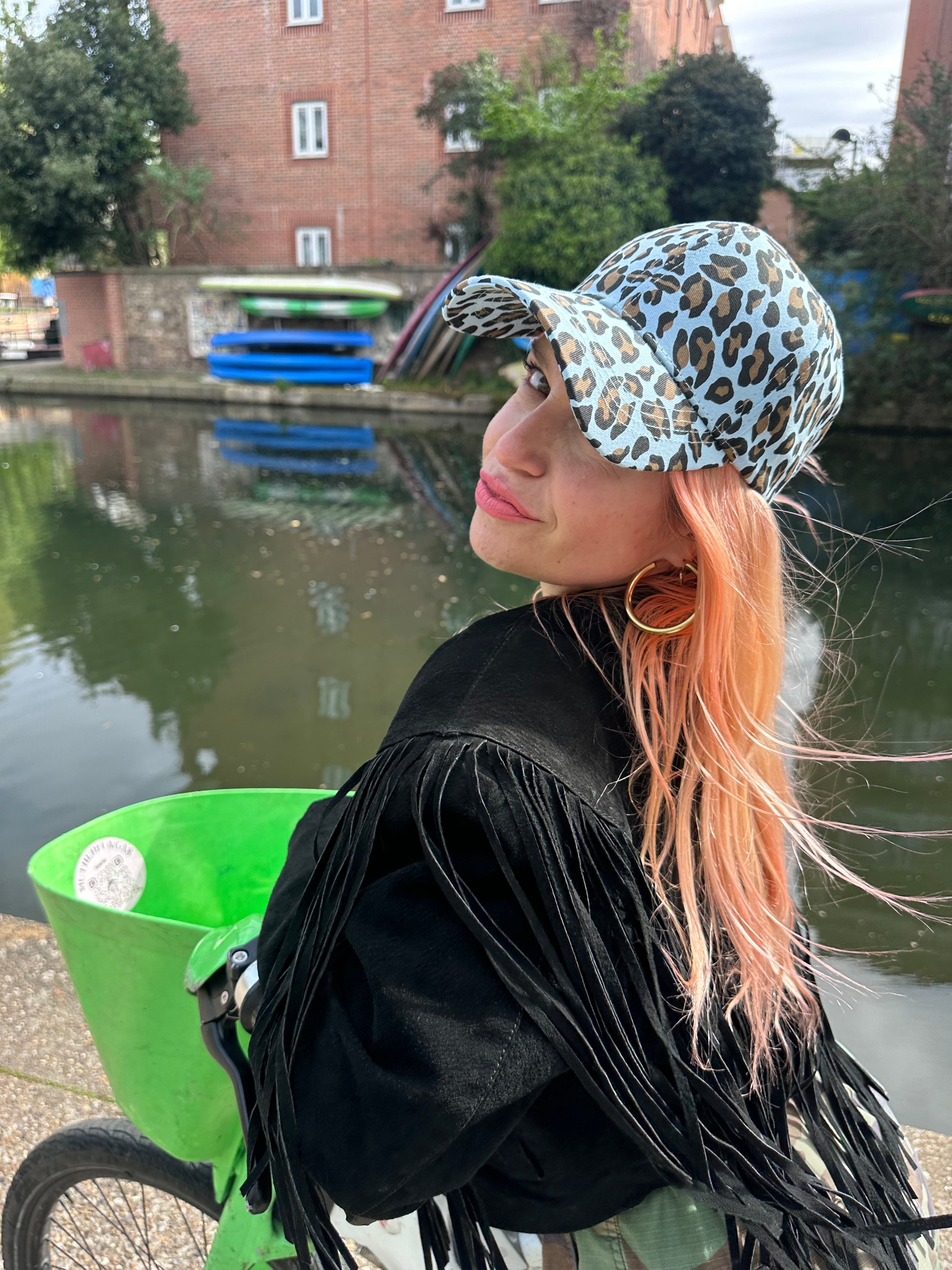 The proud peach silky lined cap in blue leopard