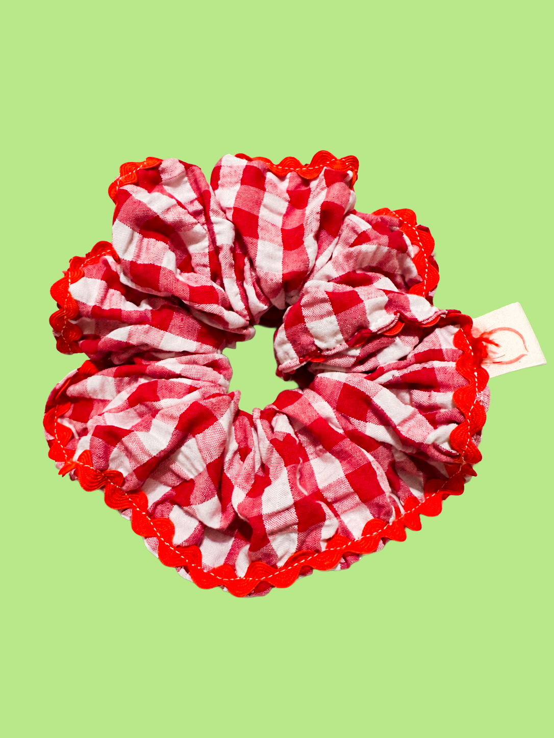 proud peach gingham scrunchie in red white and red edging