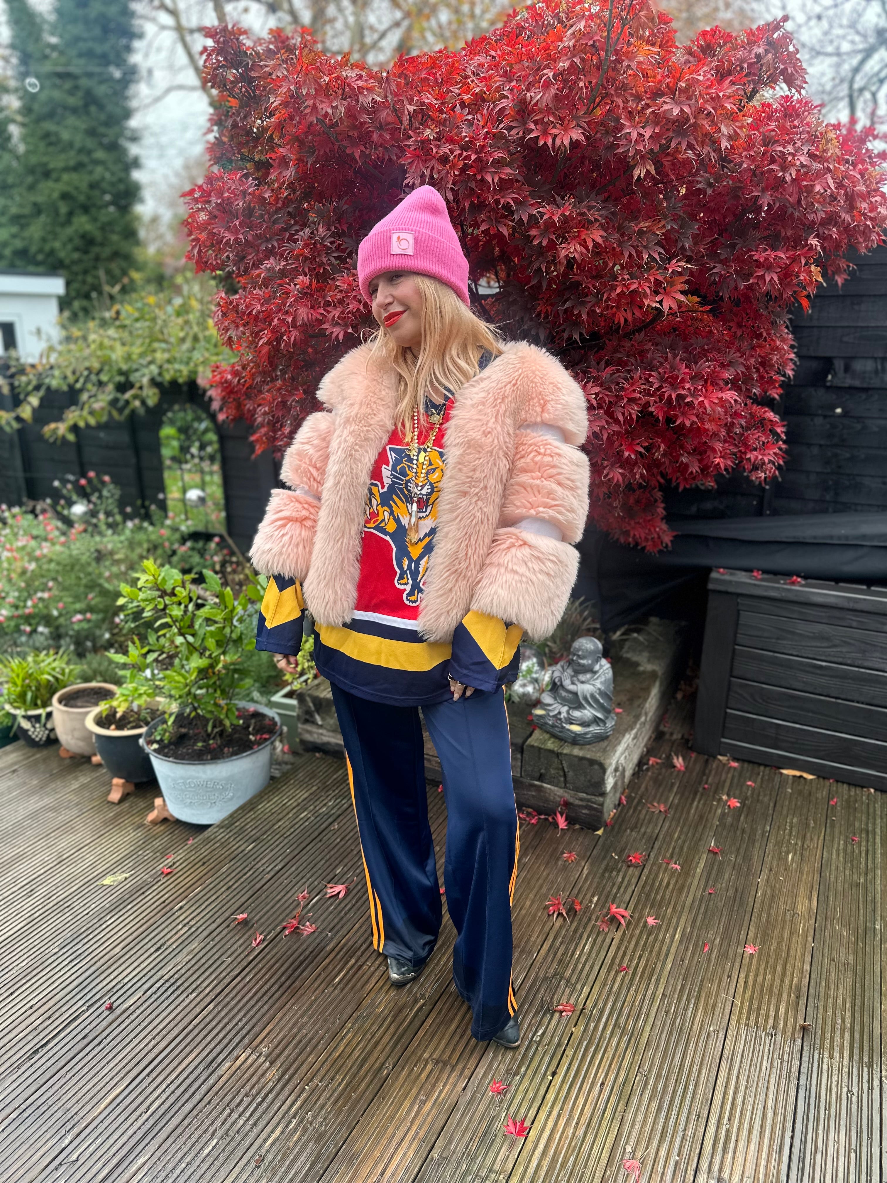 The peachy plush silky lined beanie in flamingo pink