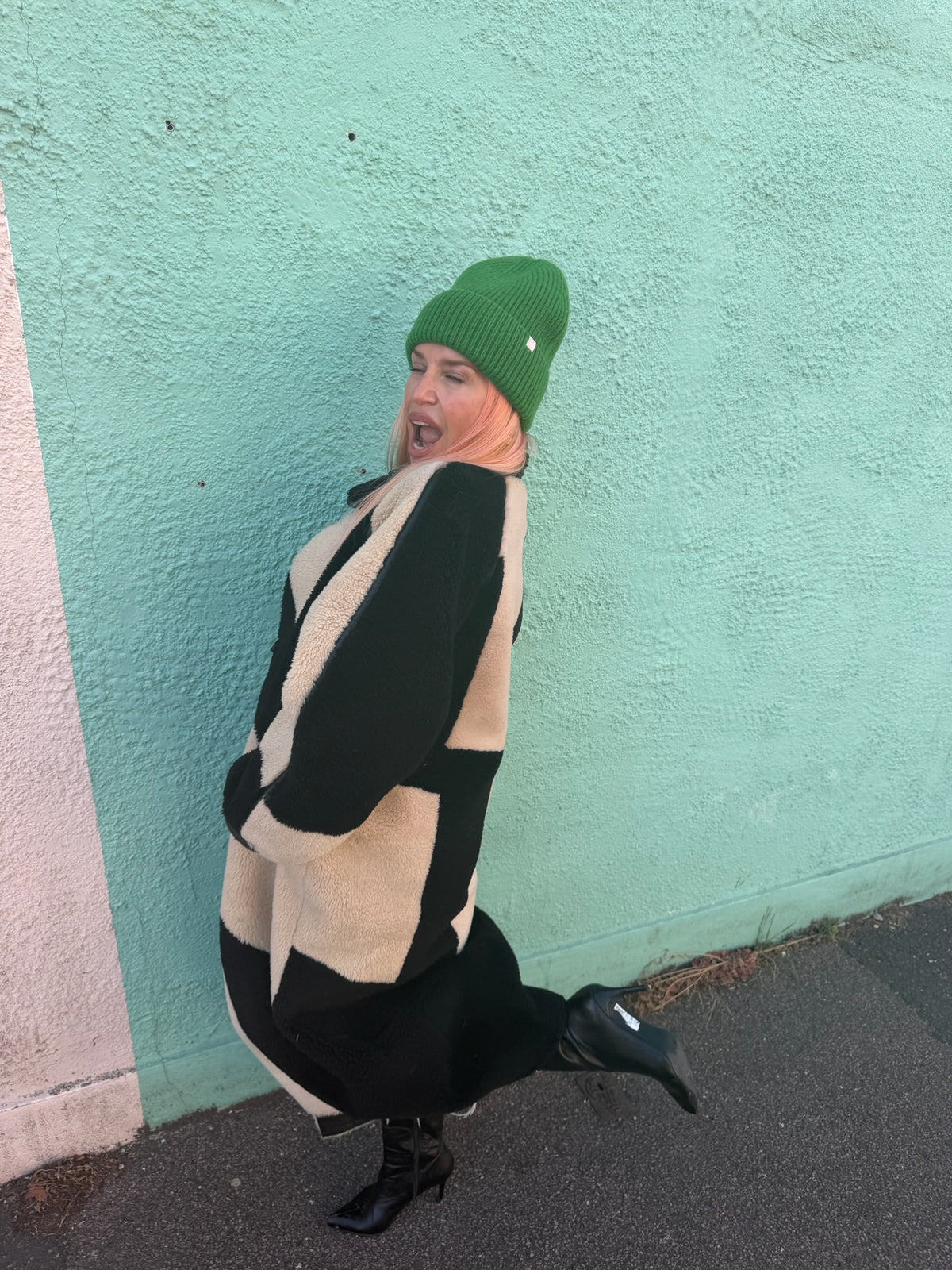 Proud peach 100% merino wool silky lined beanie in forest green