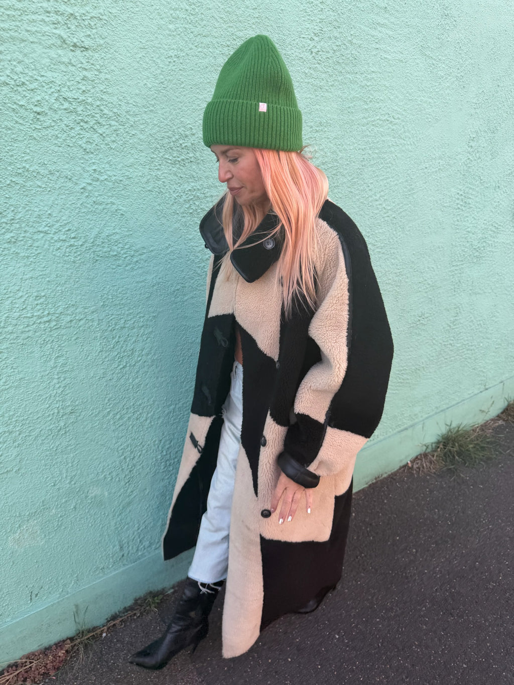 Proud peach 100% merino wool silky lined beanie in forest green