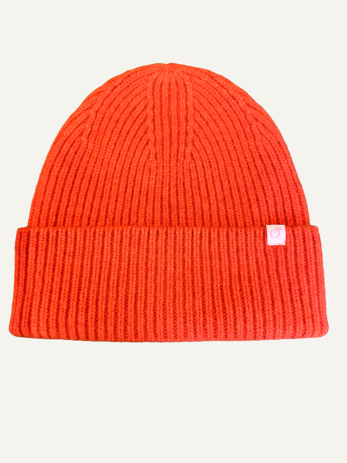 proud peach 100% merino wool beanie in burnt orange