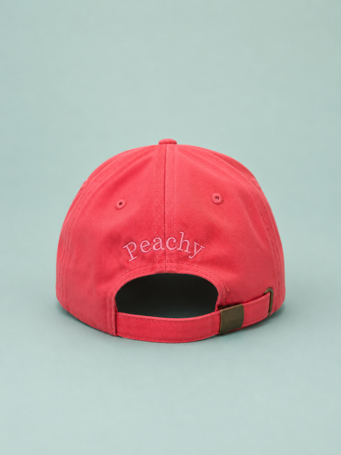 Proud peach classic silky lined cap in coral