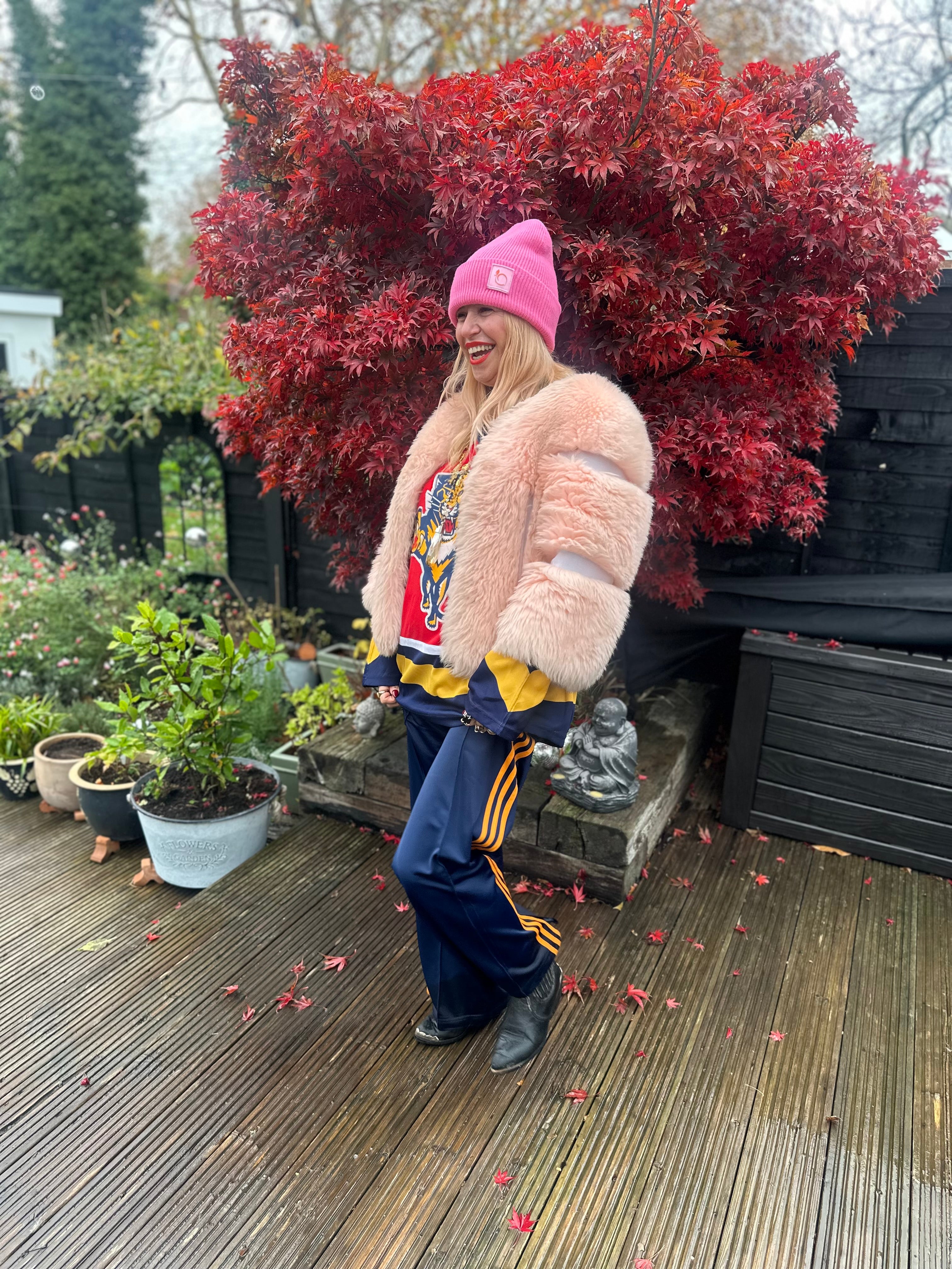 The peachy plush silky lined beanie in flamingo pink