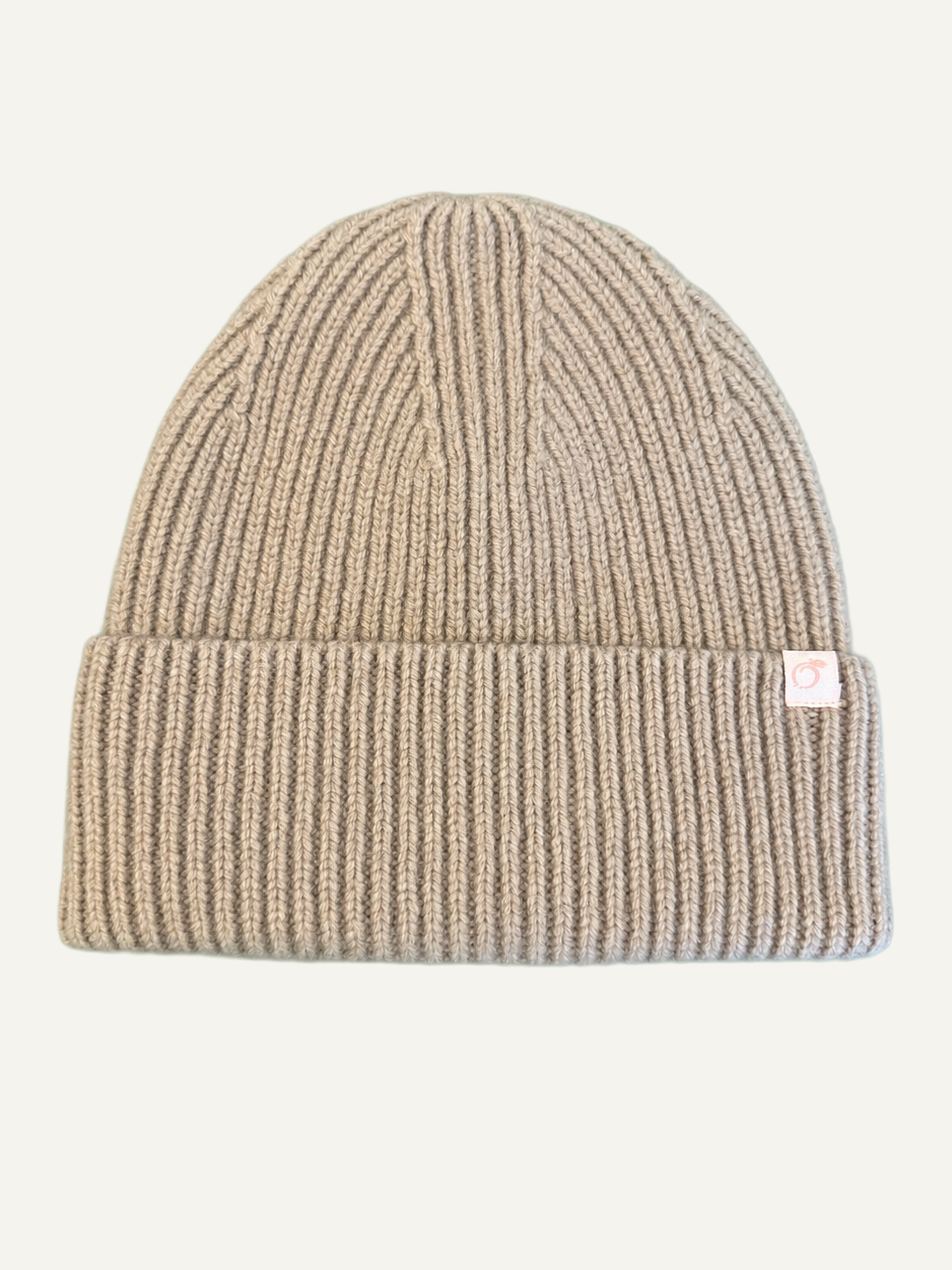 Proud peach 100% merino wool beanie in oat