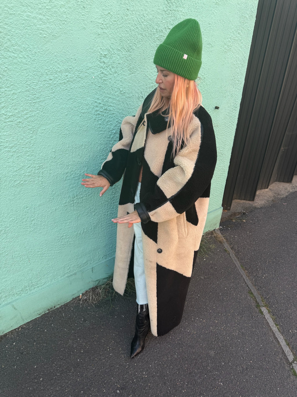 Proud peach 100% merino wool silky lined beanie in forest green