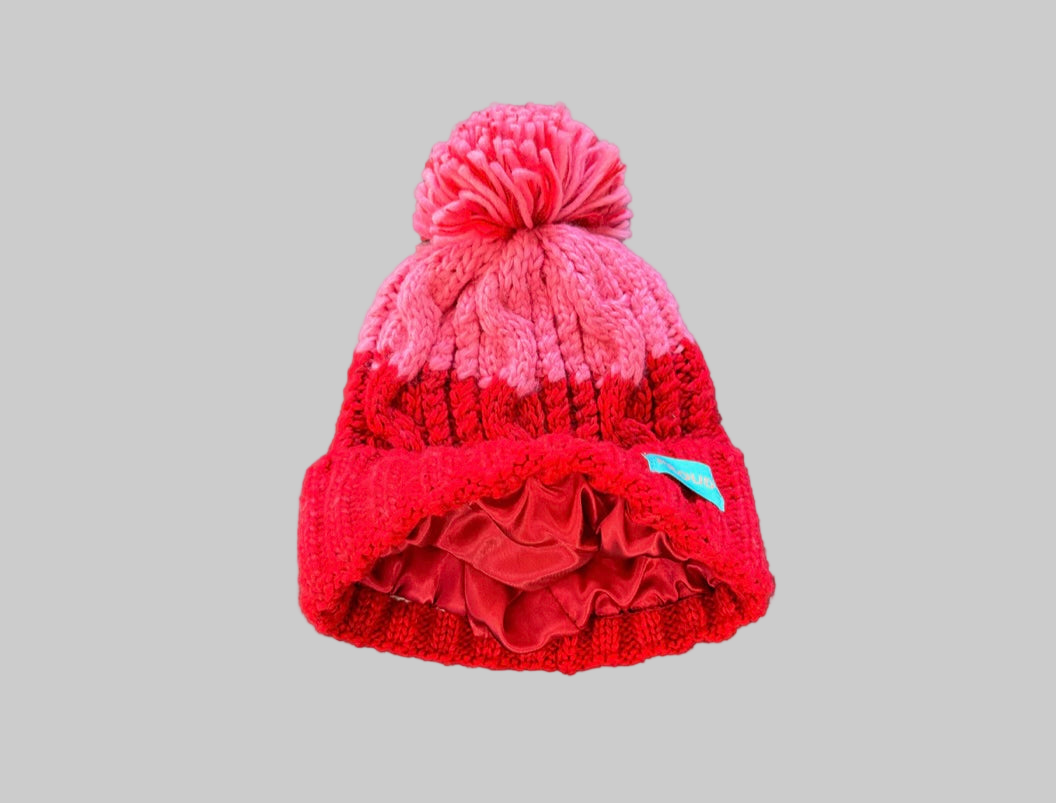 Silky lined pom pom hat in red and pink with proud logo