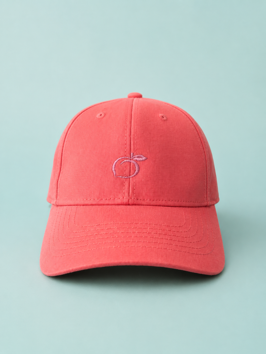 Proud peach classic silky lined cap in coral