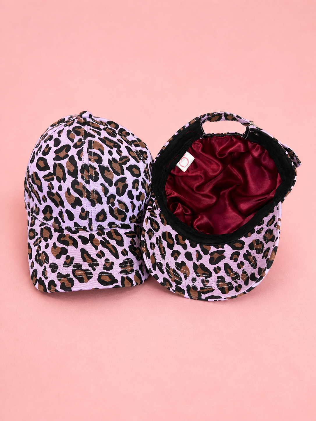 Proud peach silky lined cap in light leopard print